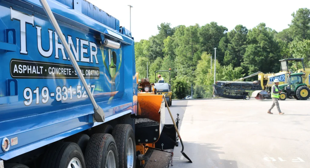 turner asphalt truck in the middle of a job