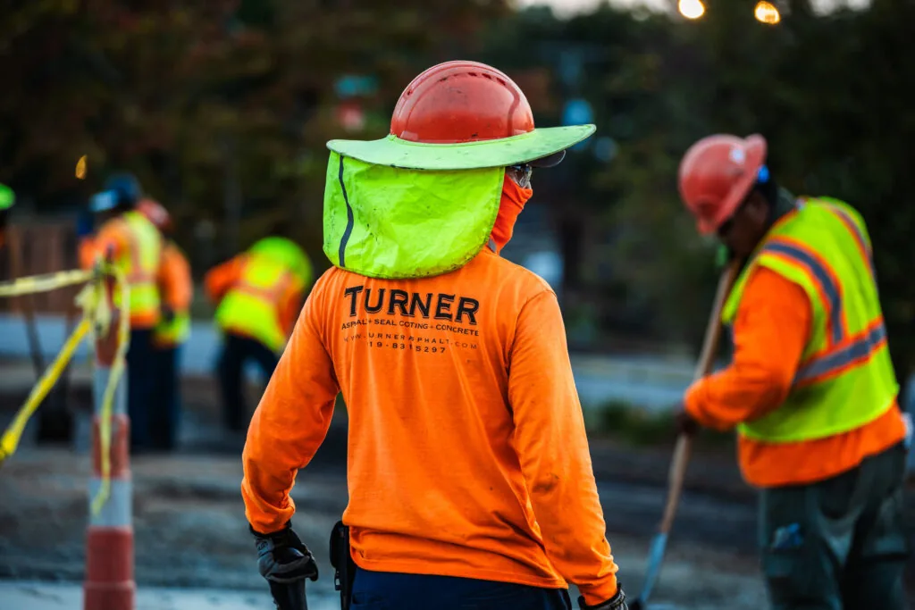 turner asphalt paving contractors in safety gear working on a paving project in murphy nc