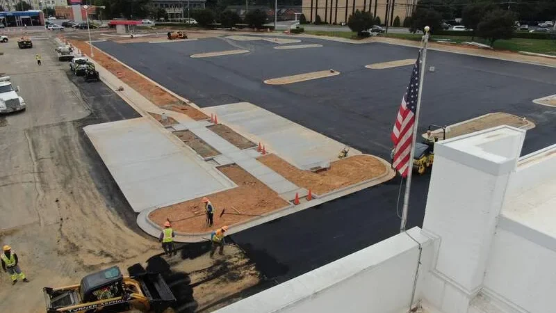 in progress photo of parking lot being paved