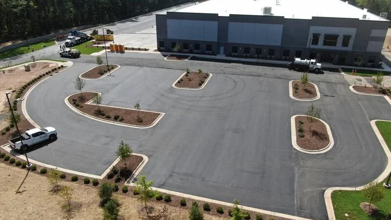 aerial view of big box store parking lot being paved
