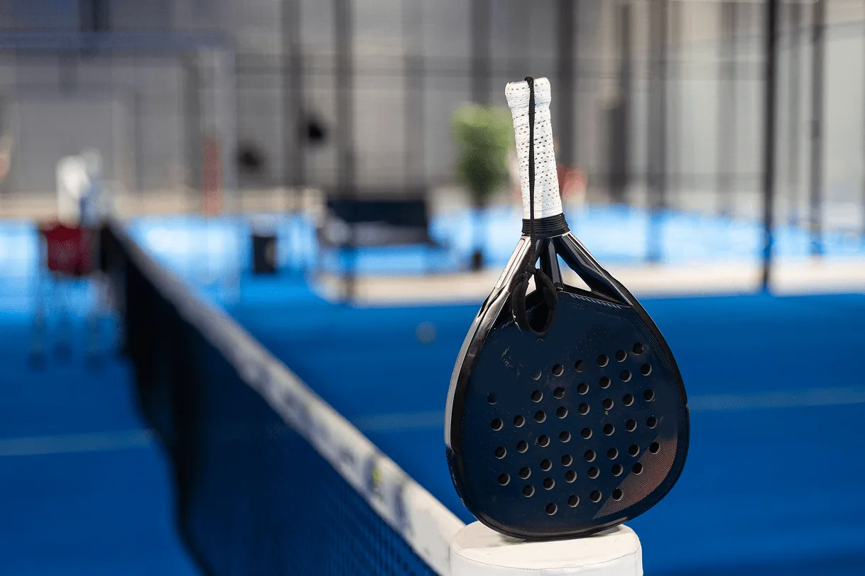 paddle-tennis-padel-racket-and-ball-in-front-of-a-2025-01-07-23-07-22-utc-min.webp
