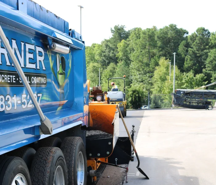 turner asphalt truck in the middle of a job