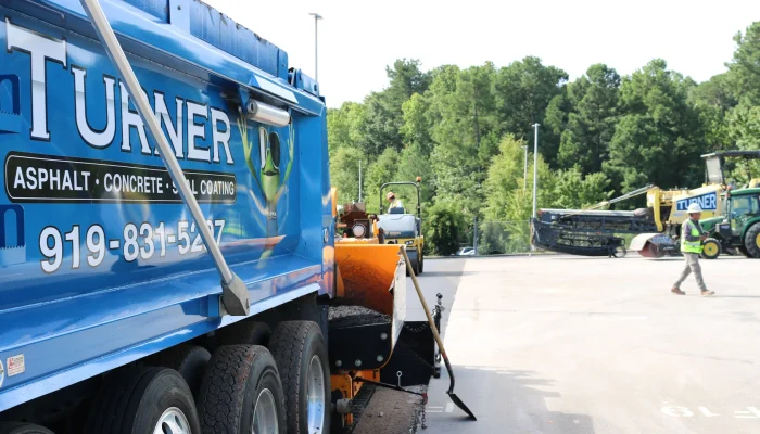 turner asphalt truck in the middle of a job