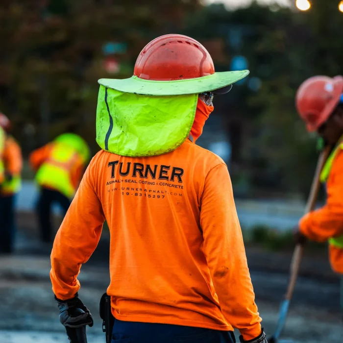 turner asphalt paving contractors in safety gear working on a paving project in murphy nc