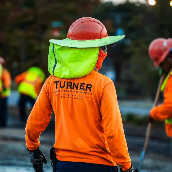 turner asphalt paving contractors in safety gear working on a paving project in murphy nc